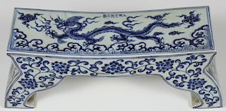 A CHINESE BLUE AND WHITE PORCELAIN DRAGON PILLOW