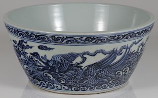 A LARGE CHINESE BLUE AND WHITE DRAGON BOWL