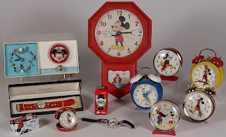 A GROUP OF 11 DISNEY CLOCKS AND WATCHES
