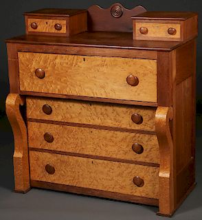 AN EMPIRE OVERHANGING CHEST OF DRAWERS