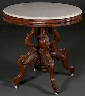 A VICTORIAN WALNUT MARBLE TOP TABLE.
