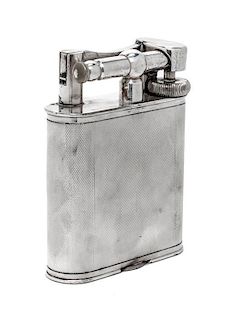 An English Silver-Plate Table Lighter, Dunhilll, Mid 20th Century, oval with straight sides and engine-turned surface.