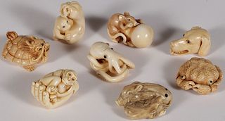 EIGHT CARVED IVORY NETSUKES