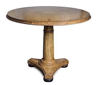 A Provincial Style Painted Breakfast Table Height 30 1/2 x diameter 39 inches.