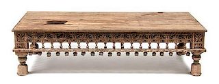 An Indian Carved Low Table Height 16 x width 62 x depth 30 inches.