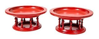A Pair of Indian Red Painted Low Tables Height 11 x diameter 25 inches.
