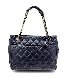 A Chanel Navy Quilted Leather Tote Handbag, 12" x 8" x 2"; Strap drop: 7".