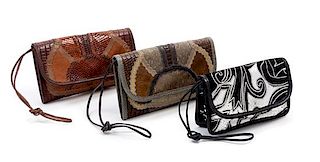 A Grouping of Three Carlos Falchi Leather and Snakeskin Clutches, First two: 9" x 5.5" x .5"; Third: 7.5" x 5" x 1".