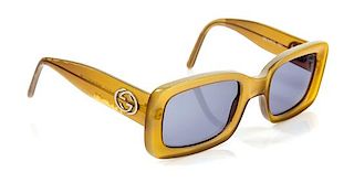 * A Pair of Gucci Light Brown Sunglasses,