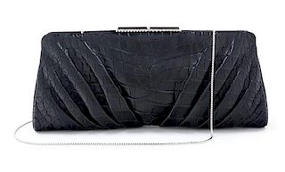 A Judith Leiber Black Leather Embossed Clutch, 12" x 5.5" x 1.5".