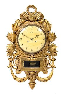 A Swedish Giltwood Wall Clock Height 34 x width 20 1/2 inches.