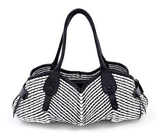 * A Salvatore Ferragamo Black and White Leather Woven Handbag, 18" x 8" x 6"; Strap drop: 8".