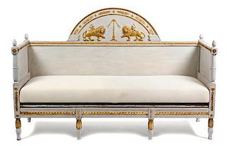 A Swedish Painted and Parcel Gilt Daybed Height 48 x width 75 x depth 25 inches.
