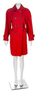 An Yves Saint Laurent Red Cotton Double Breasted Trench Coat, Size 34.