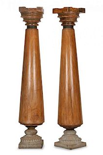 A Pair of Teak Columns Height 83 inches.