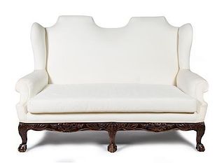 A George I Style Walnut Wingback Sofa Height 47 x width 71 x depth 37 inches.