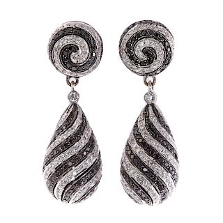 A Pair of Spiral Black & White Diamond Earrings