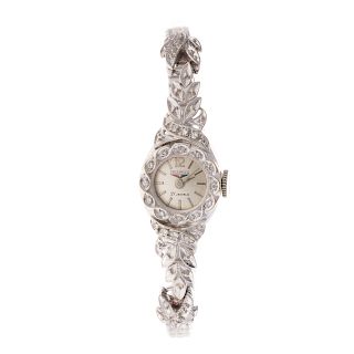 A Lady's Benrus Diamond Watch in 14K Gold