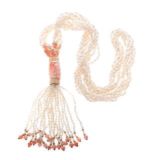 A Strand of Freshwater Pearls & Carved Coral