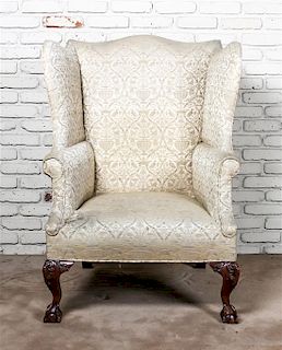 A Chippendale Style Walnut Wingback Armchair, Height 44 inches.