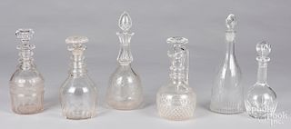 Five colorless glass decanters, etc.