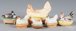 Four porcelain hen on nests, etc.