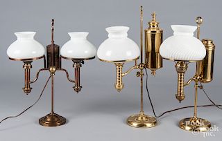 Three brass student lamps with milk glass shades