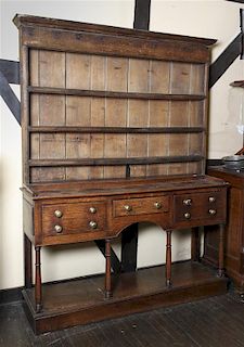 An Oak Welsh Cupboard in Two Parts, Height 82 x width 61 1/4 x depth 16 1/2 inches.