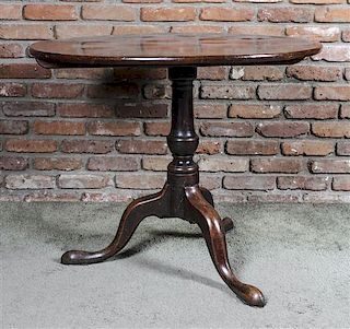 A Queen Anne Style Mahogany Tilt-Top Tea Table, Height 28 x diameter 35 1/2 inches.