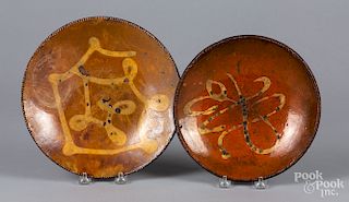 Two New England slip decorated redware plates