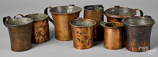 Eight copper mugs