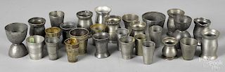 Collection of small pewter measures and beakers