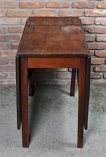 A George III Mahogany Drop-Leaf Table, Height 28 x width 16 3/4 x depth 35 inches (closed).