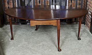 A George III Mahogany Drop Leaf Table, Height 28 x width 23 1/2 x depth 47 1 /2 inches (closed).