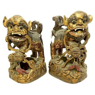 Pair of Large Chinese Gilt Wood Foo Dog Carvings
