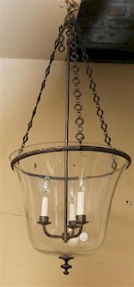 A Brass and Blown Glass Lantern, Height 35 inches.