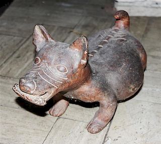 A Colima Style Pottery Figure, Length 13 1/4 inches.