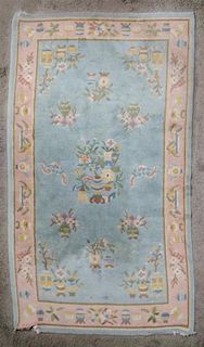 A Chinese Wool Rug, 6 feet 9 inches x 3 feet 11 inches.