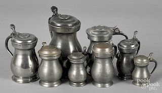 Eight pewter baluster measures