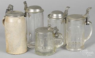 Four glass steins with pewter lids