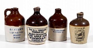 WHISKEY AND OTHER ADVERTISING STONEWARE MOTTO JUGS, LOT OF FOUR