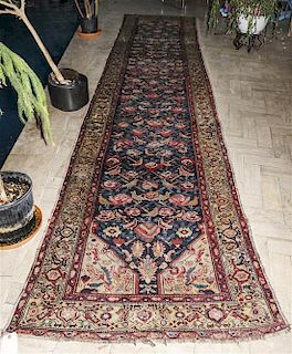 A Northwest Persian Wool Runner, 15 feet 4 inches x 3 feet 5 inches.