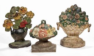 ASSORTED FIGURAL FLORAL CAST-IRON DOORSTOPS, LOT OF THREE