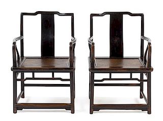 * A Pair of Chinese Black Lacquered Elmwood Official's Hat Armchairs, Nanguanmaoyi Height 34 x width 23 1/8 x depth 18 inches.