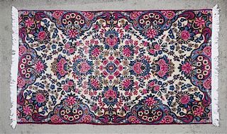 A Kerman Silk Rug, 4 ft 10 inches x 2 ft 10 inches.