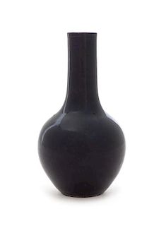 * A Chinese Dark Aubergine Glazed Porcelain Bottle Vase Height 5 1/2 inches.