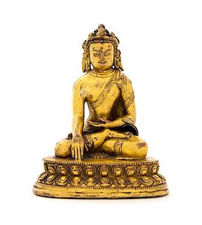 A Sino-Tibetan Gilt Bronze Figure of a Bodhisattva Height 4 1/8 inches.