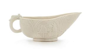 A Blanc-de-Chine Porcelain Libation Cup Length 5 1/2 inches.