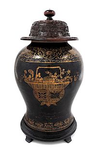 A Gilt Decorated Mirror Black Glazed Porcelain Baluster Jar Height 12 inches.