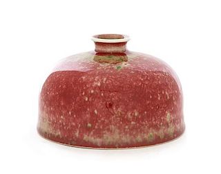 A Peachbloom Glazed Beehive-Form Porcelain Waterpot, Taibaizun Height 3 3/4 inches.